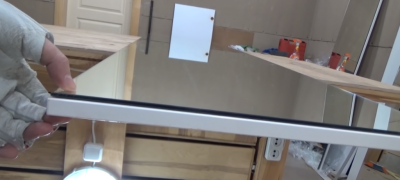 How to remove a glued mirror from a cabinet door