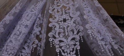 Detailed description of tulle with embroidery