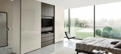 Features of the design of a wardrobe with a niche for a TV