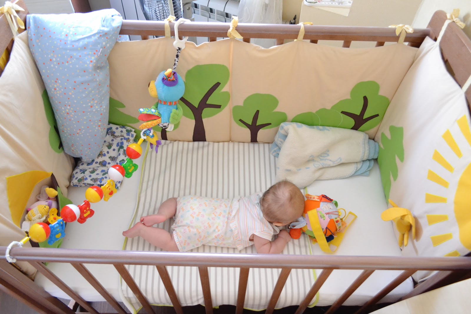 protective bumpers in the crib for the baby