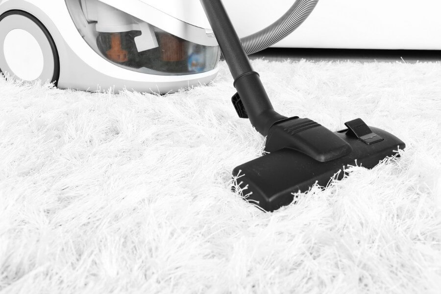 vacuuming carpet