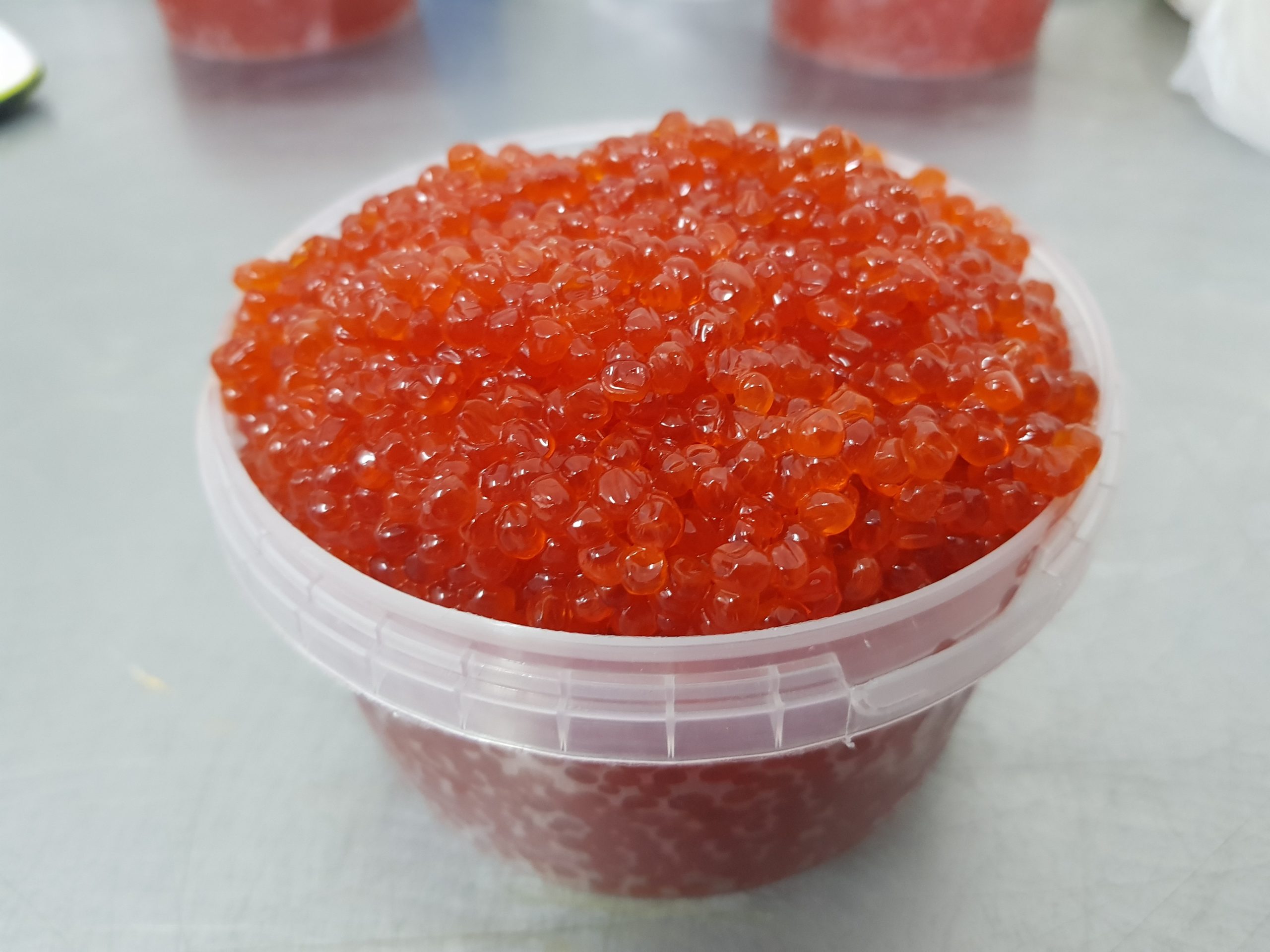 red caviar in a plastic jar