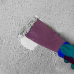 removing paint with a spatula