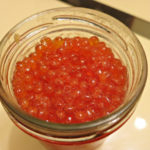 glass jar with red caviar