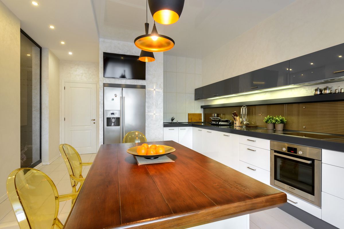 TV in the kitchen above the refrigerator