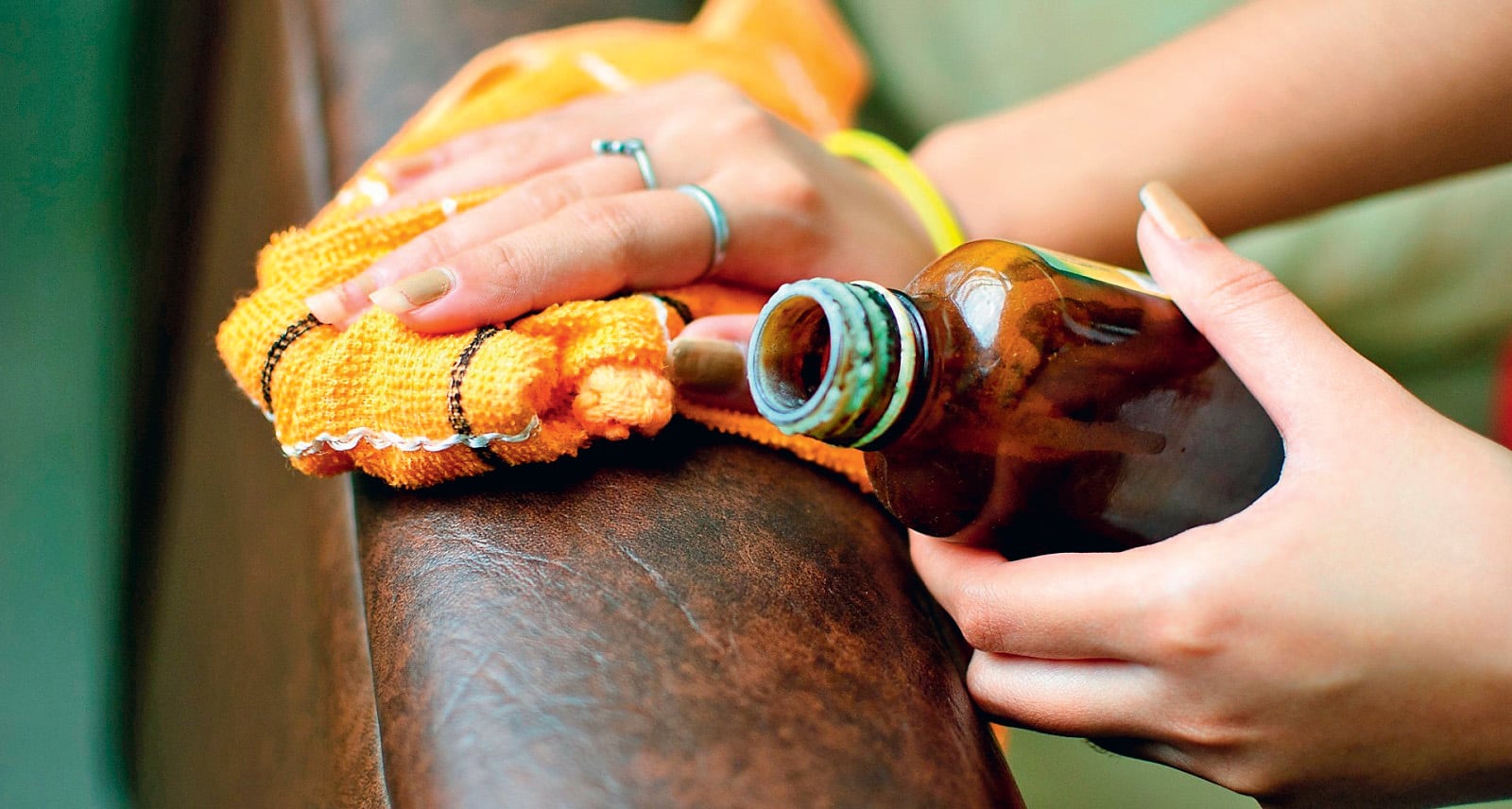 cleaning a leather sofa from brilliant green