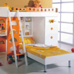 a loft bed with a sofa in the children's room