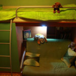 loft bed with green sofa