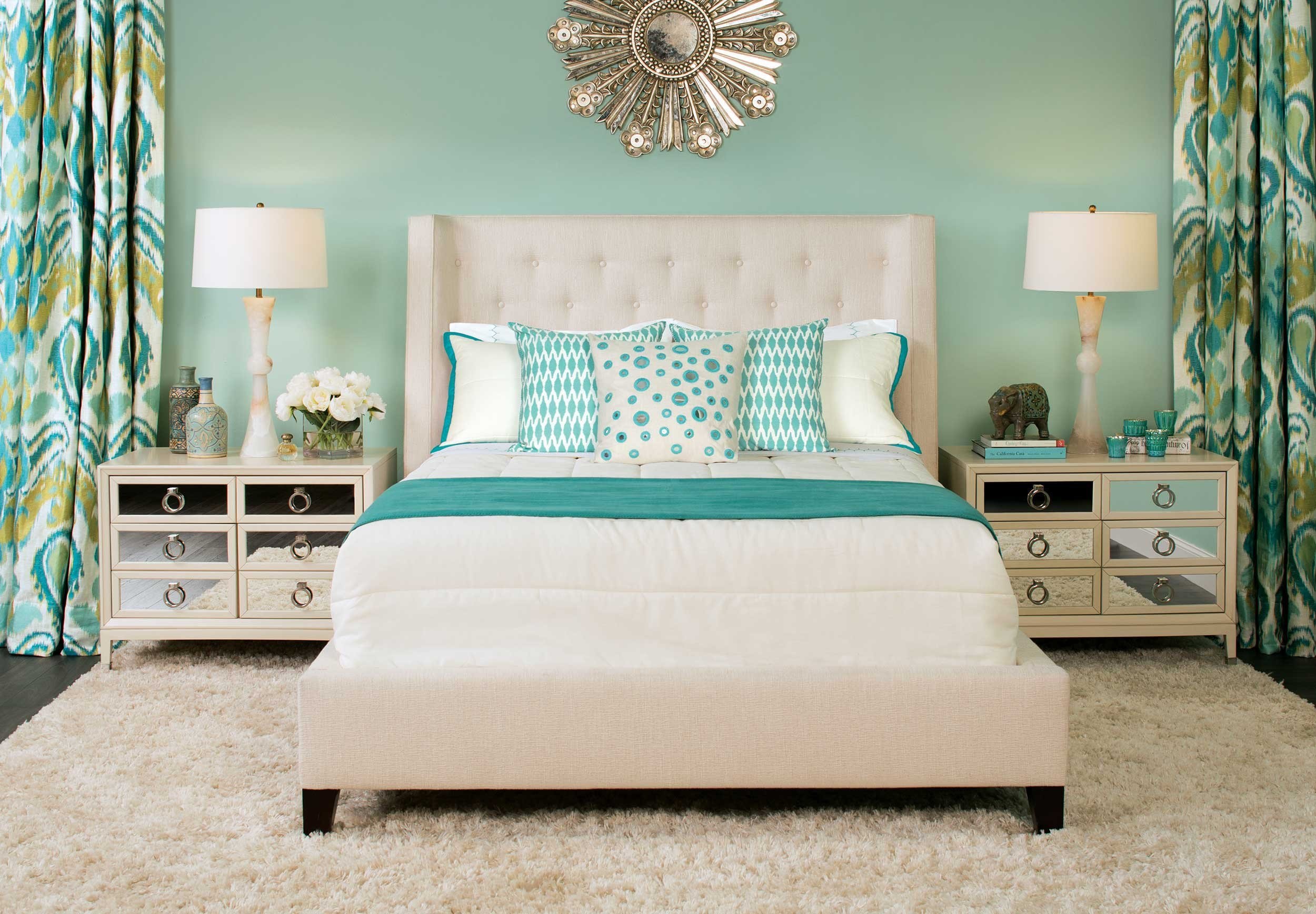 bed with turquoise pillows