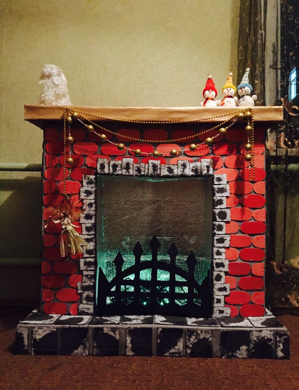 fireplace made of cardboard with a decorative grate