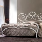 wrought iron bed in the bedroom