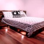 pallet bed with black and white bed