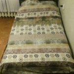 pallet bed with green bedspread