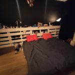 pallet bed with red pillows