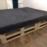 pallet bed with dark mattress