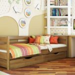 small wooden bed with drawers