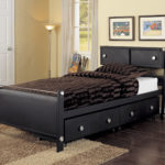 black bed with drawers