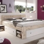 bed with drawers in the bedroom