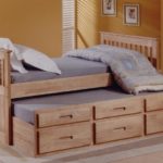 tall wooden bed with drawers