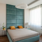 beds with a soft headboard in the interior of the bedroom