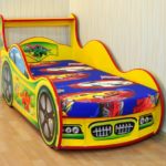 yellow-colored car bed for a boy