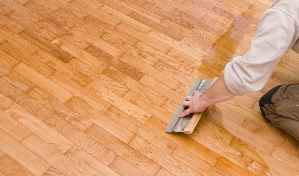 rubbing linoleum with oil