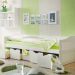 bed with drawers in light green interior