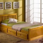 single wooden bed with drawers