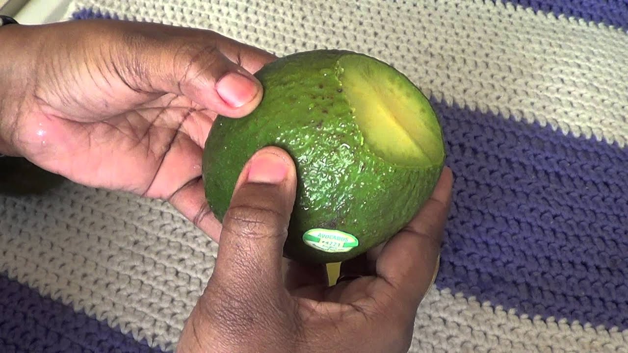 checking avocado for ripeness