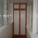 wardrobe on the balcony with a brown frame