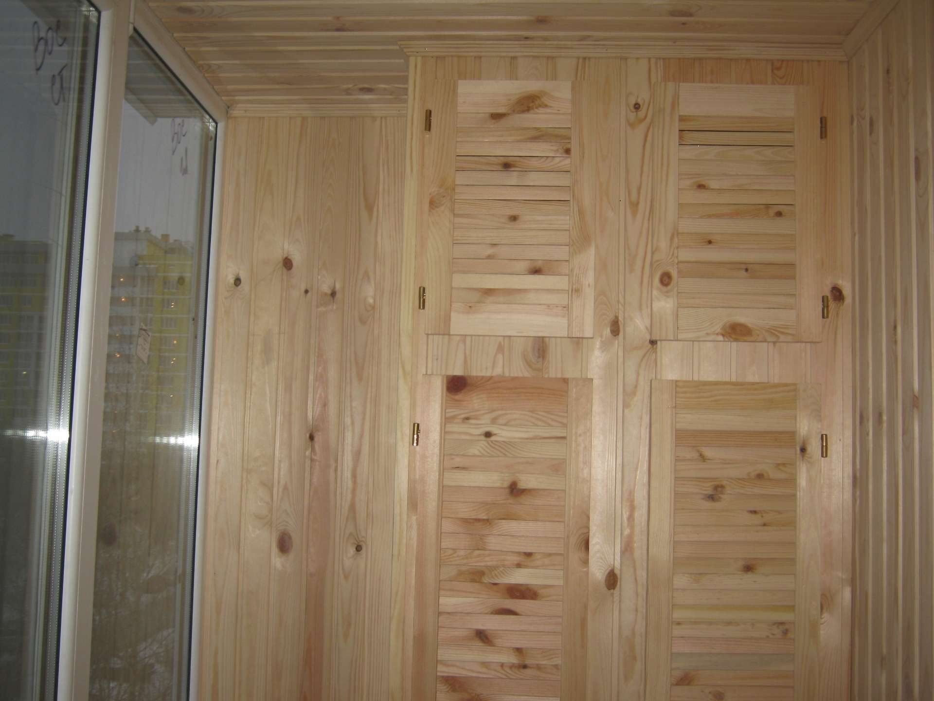 wardrobe on the balcony made of natural wood