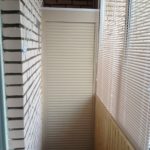 wardrobe on the balcony with blinds