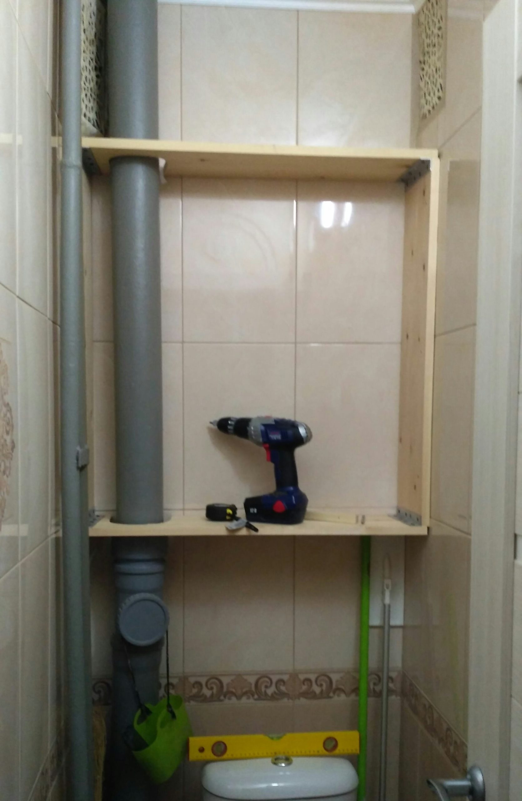 the process of installing the cabinet in the toilet