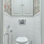 wardrobe in the toilet with floral wallpaper