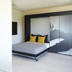 transformable bed behind the wardrobe