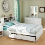 large white bed with drawers