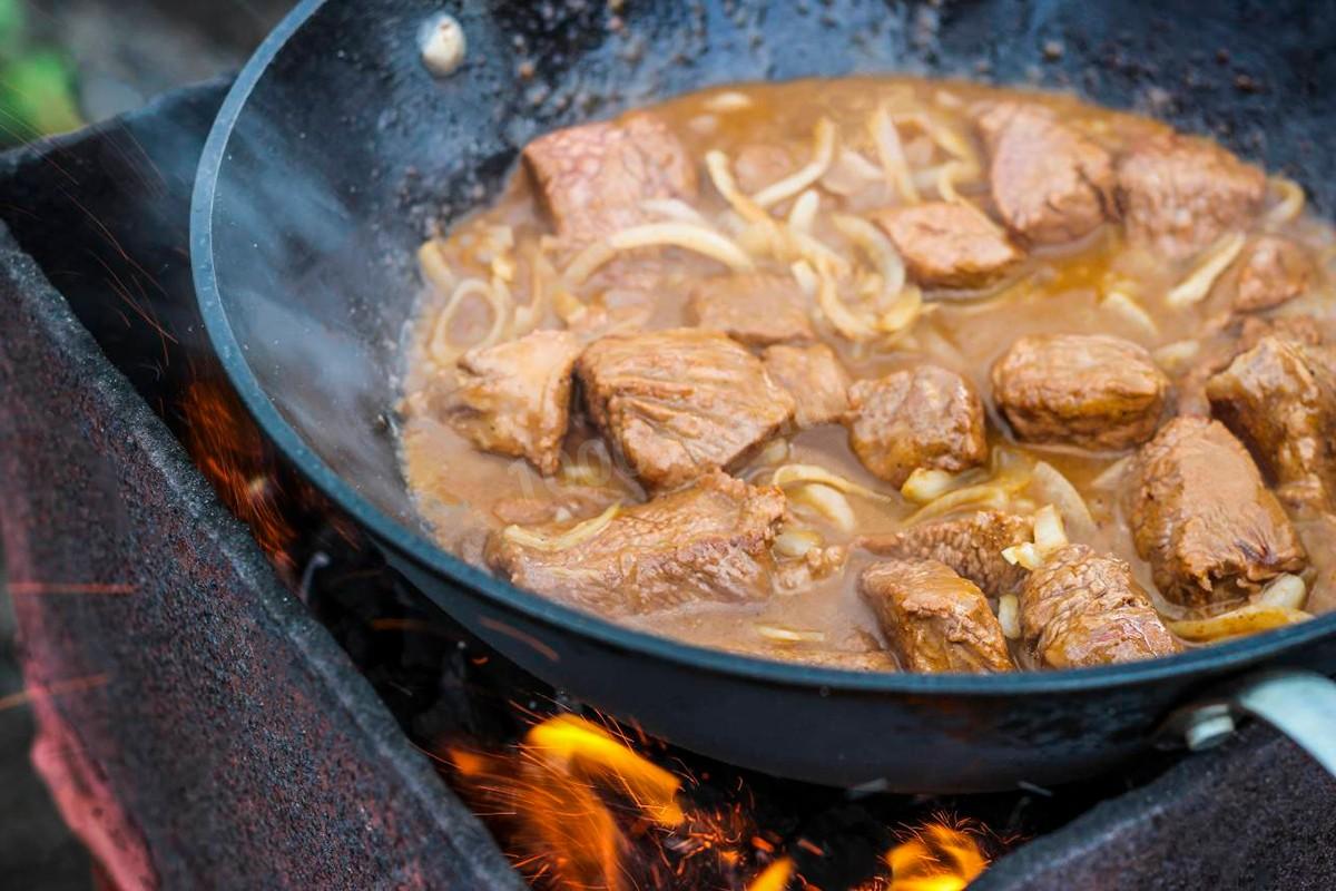 dishes in a cauldron on the fire