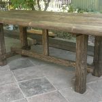 a table in a gazebo from a log house