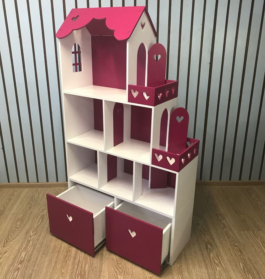 a house with a chest of drawers for a nursery