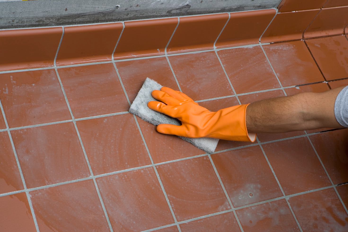 removing the top layer of grout