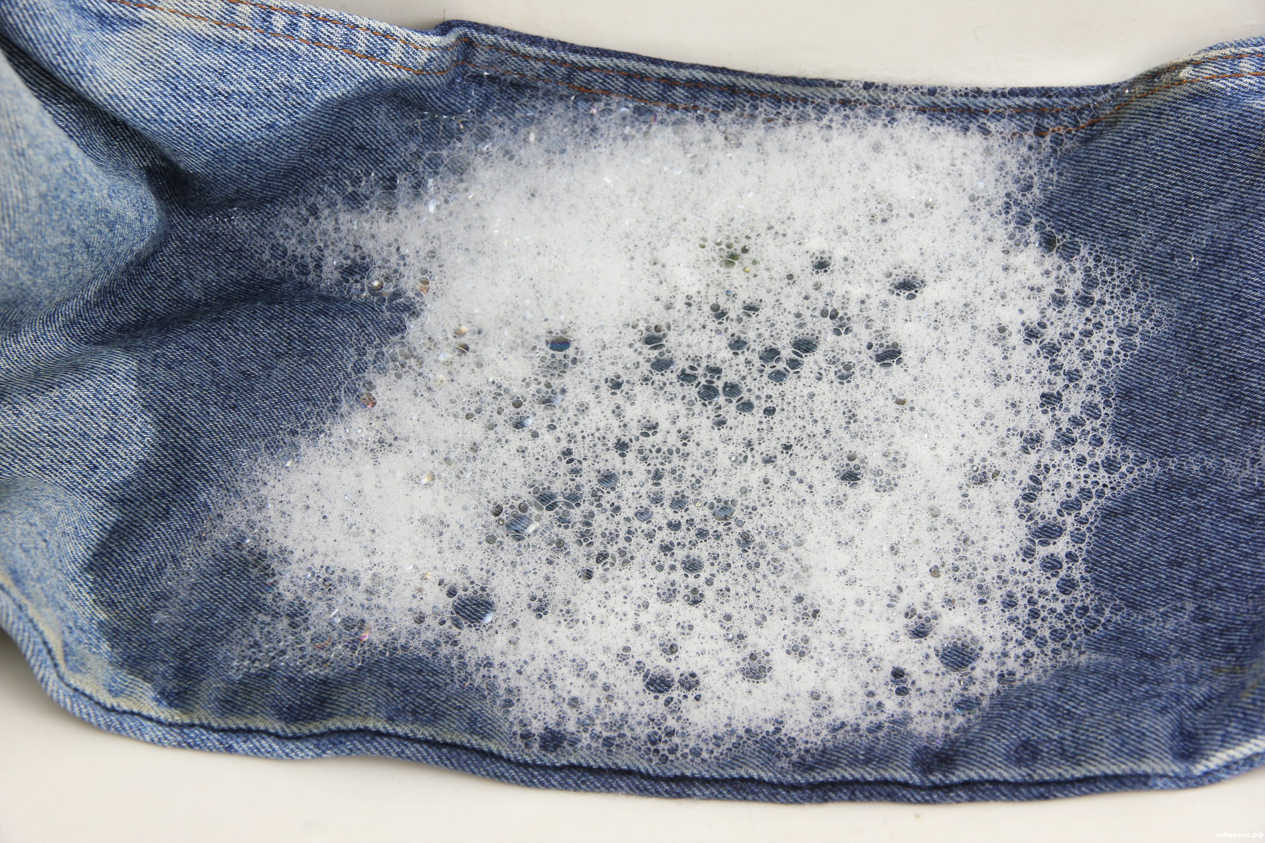 washing jeans in a basin