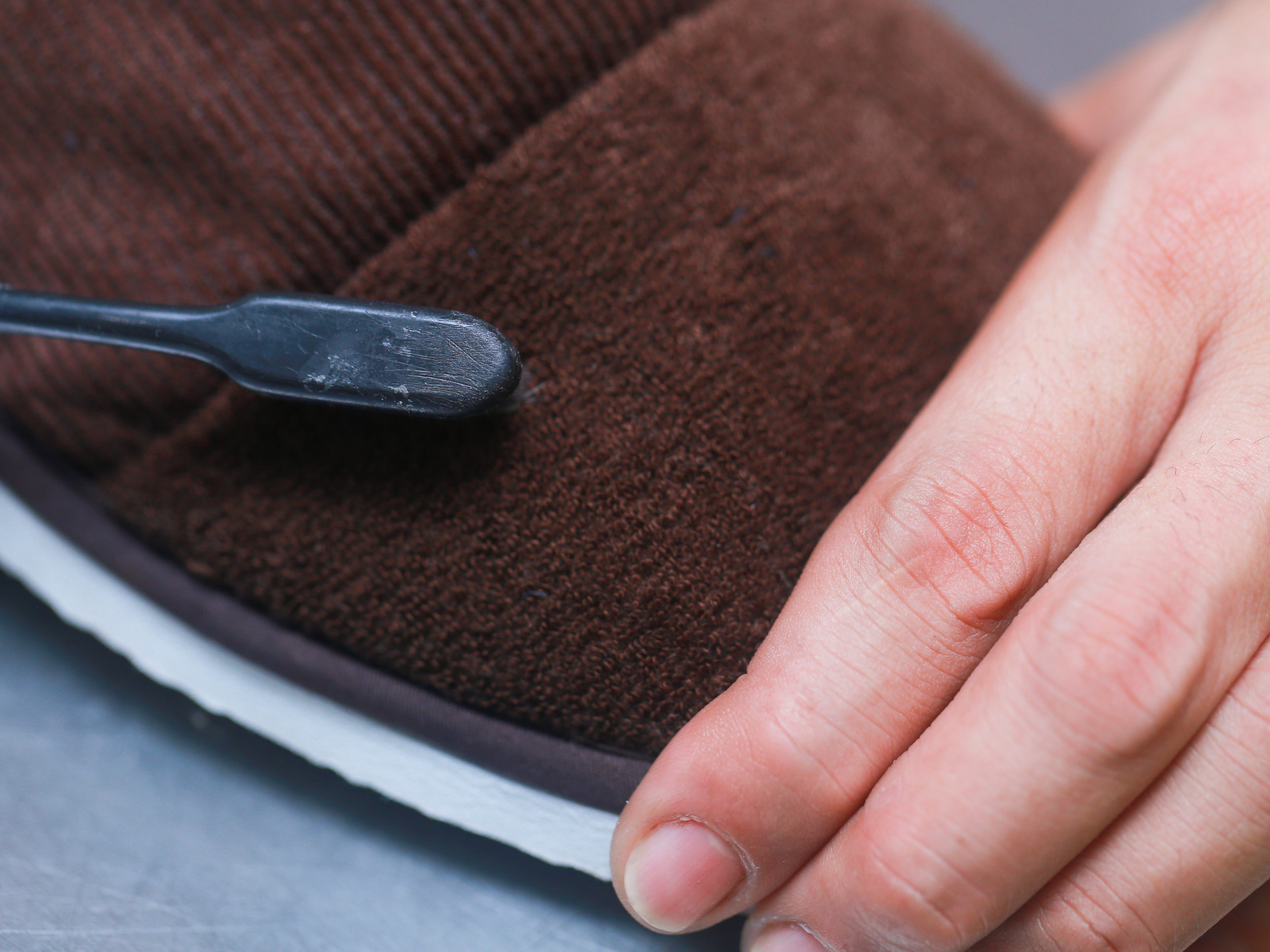 cleaning the cap with a dry brush