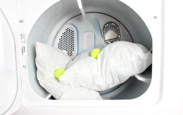 washing a pillow with tennis balls