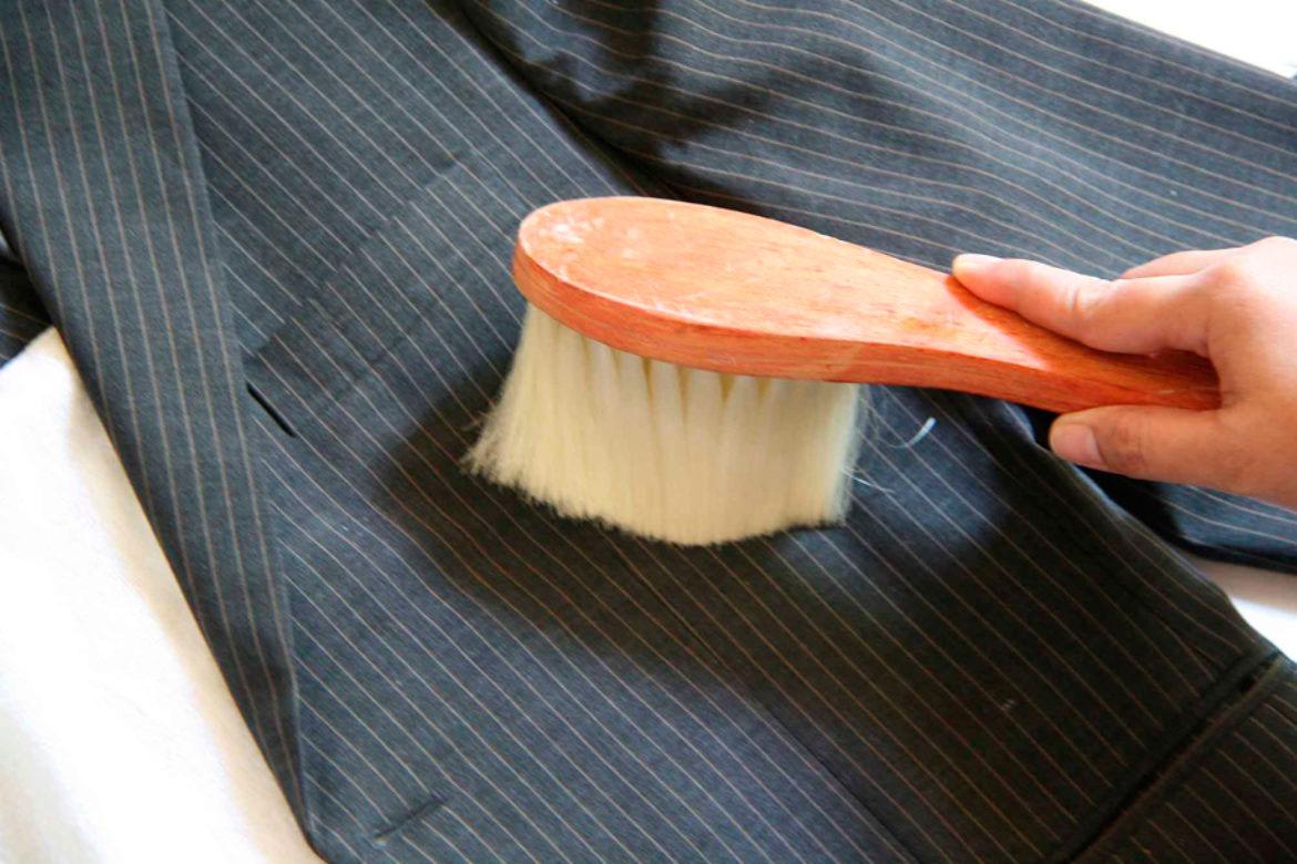 cleaning the jacket with a brush