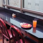 sill-table top with red chairs