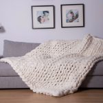 small knitted bedspread on the sofa