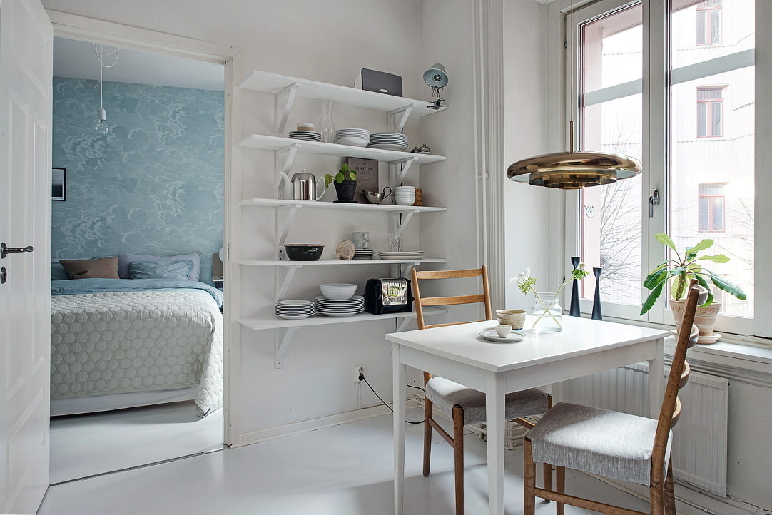 shelves on the wall in the kitchen