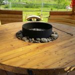 a table in a gazebo with a hearth