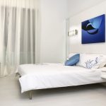 bed with blue picture