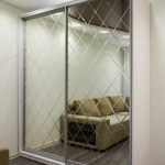 sliding wardrobe with faceted mirror decor photo